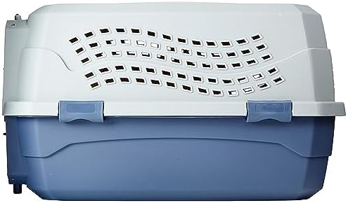 Amazon Basics dog and cat airline carrier being carried by the heavy duty top handle