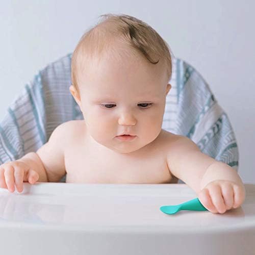 Infant self feeding spoon demonstrating the flexible and gentle silicone material.