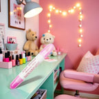 Using pink nail polish corrector pen to clean nail cuticle edges
