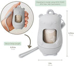 Moodie portable waste bag dispenser showing twist-off bottom cap