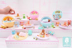 MGA's Miniverse miniature baby doll with open eyes and tiny feeding bottle accessory.