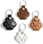 Close up of Evowatt paw shaped fur storage keychain