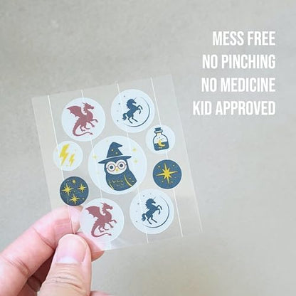Close up view of Quitch bug bite anti itch stickers applied to a childs arm