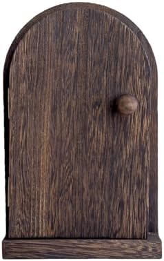 Handcrafted wooden outlet cover with brass knob installed on wall