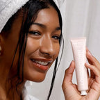 Manicure stain remover cream texture displayed next to a clear acrylic bristle hand grooming brush