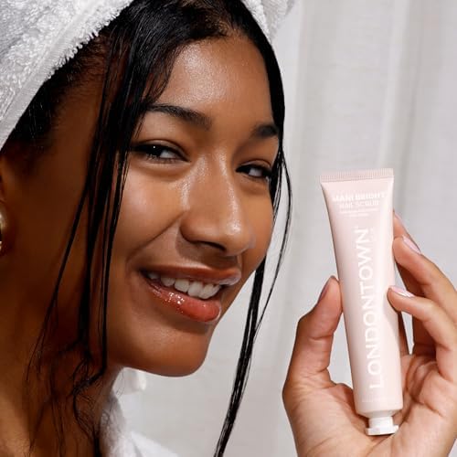Manicure stain remover cream texture displayed next to a clear acrylic bristle hand grooming brush
