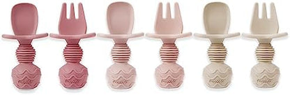 PandaEar infant training fork and spoon set in soft pink color variations for early stages.
