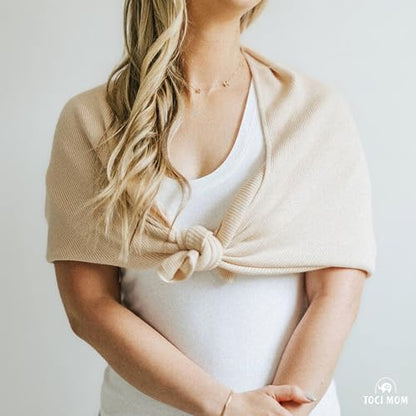 Toci Mom nursing scarf folded neatly for travel in a diaper bag