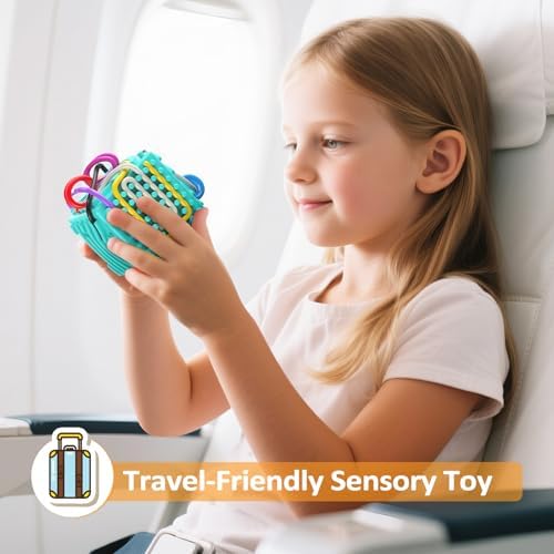 Toddler hands weaving long silicone ropes on MoodLife 3D sensory board