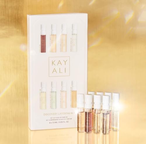 Eight-piece Kayali fragrance sampler collection unboxed showcasing individual travel-sized spray bottles.