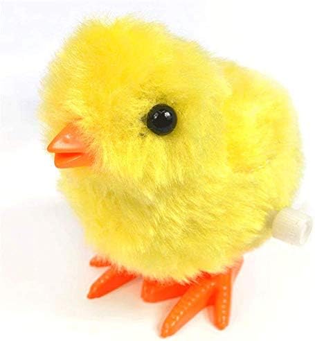 Toddler hand holding a compact mechanical wind up chicken favor