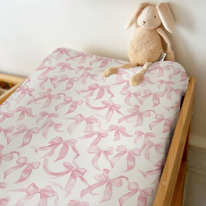 Side view showing elastic fit of baby changing pad cover