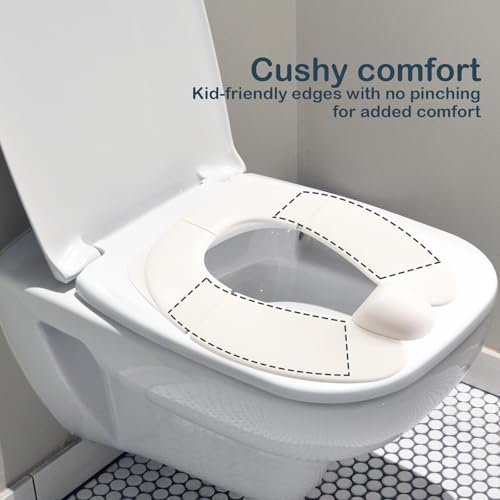 Deeki foldable toddler potty seat hanging by its storage hook next to a bathroom vanity