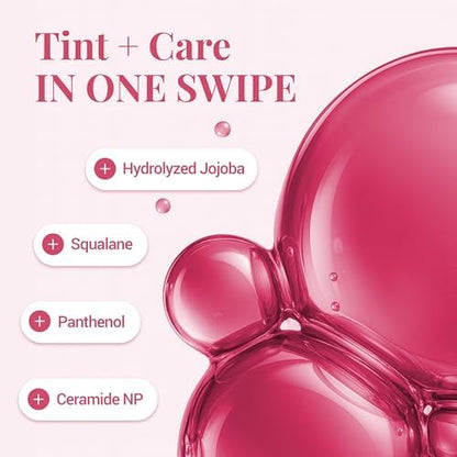 Close up view of the product bottle highlighting the hydrating ingredients jojoba oil and squalane.