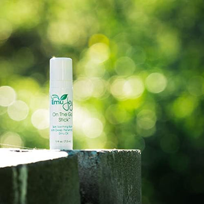 Pocket sized Emu Joy skin balm stick showing the twist up applicator.
