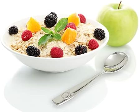 Stainless steel kids spoon showing engraved apple handle design