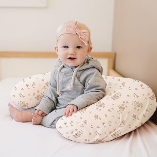 Konssy newborn baby feeding pillow slipcovers neatly folded to showcase the elasticized stretchable edges.