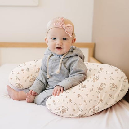 Konssy newborn baby feeding pillow slipcovers neatly folded to showcase the elasticized stretchable edges.