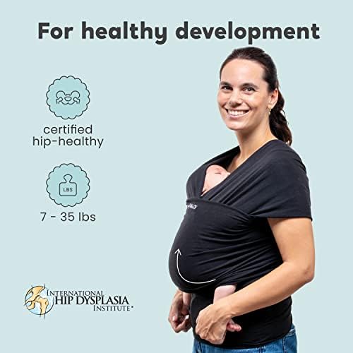 Infant sitting safely inside a CuddleBug baby holder wrap