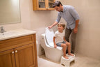 Unfolded flushable paper toilet seat liner showing the universal design for western toilets
