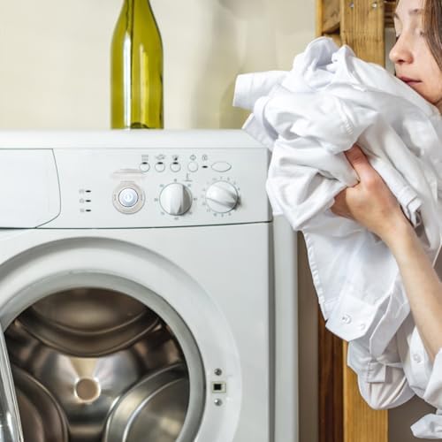 Parent installing adhesive child safety lock on a washing machine
