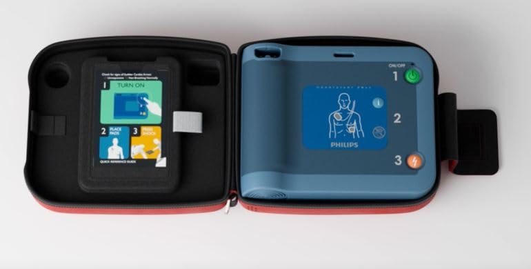 Complete contents of the Philips AED Ready Pack showing the manual and spare adult pads.