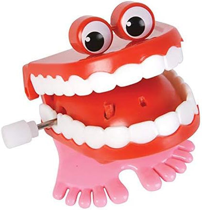 Two pack of imported mechanical chomping teeth toys with googly eyes and pink feet