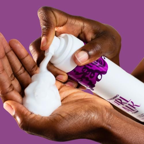 Lightweight frizz control mousse texture squeezed out for application.