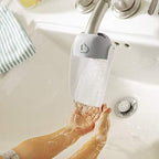 Side profile view of Munchkin faucet extender installed on sink