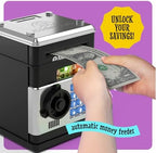 Imagineers electronic piggy bank with a paper bill being automatically pulled into the motorized feeder slot.