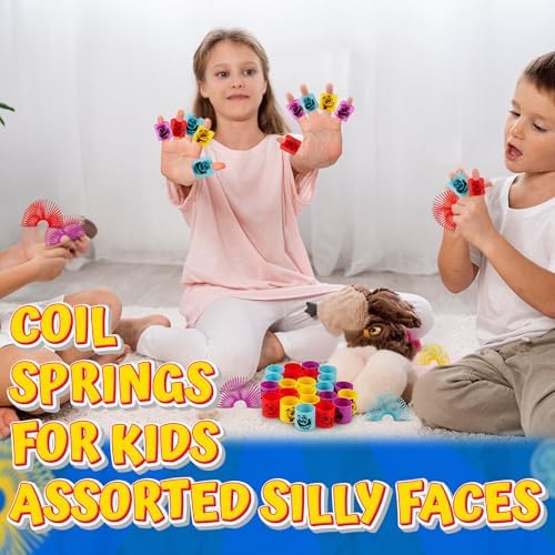 Vibrant assortment of Bedwina mini slinky toys in red blue yellow purple and pink colors spread out.