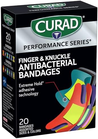 Back of Curad Performance Series box displaying the four sided seal protection and antibacterial pad features