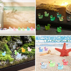 Hand holding a group of tiny glow in the dark resin ducks.