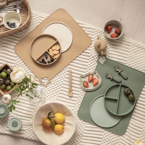 Two pack of Moonkie non slip children feeding mats laid flat on a dining table.