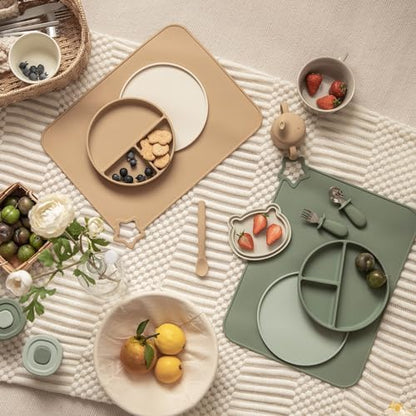 Two pack of Moonkie non slip children feeding mats laid flat on a dining table.