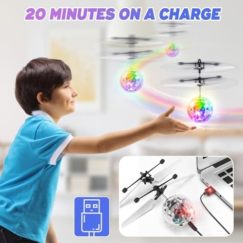 Children playing with the Ocditikl hand sensor flying crystal ball drone outdoors.