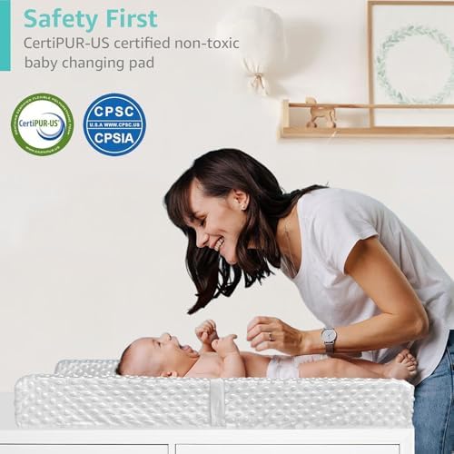 YENING grey baby changing pad being wiped clean with a cloth