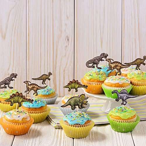 Ephlyn dinosaur decorations inserted into party cupcakes