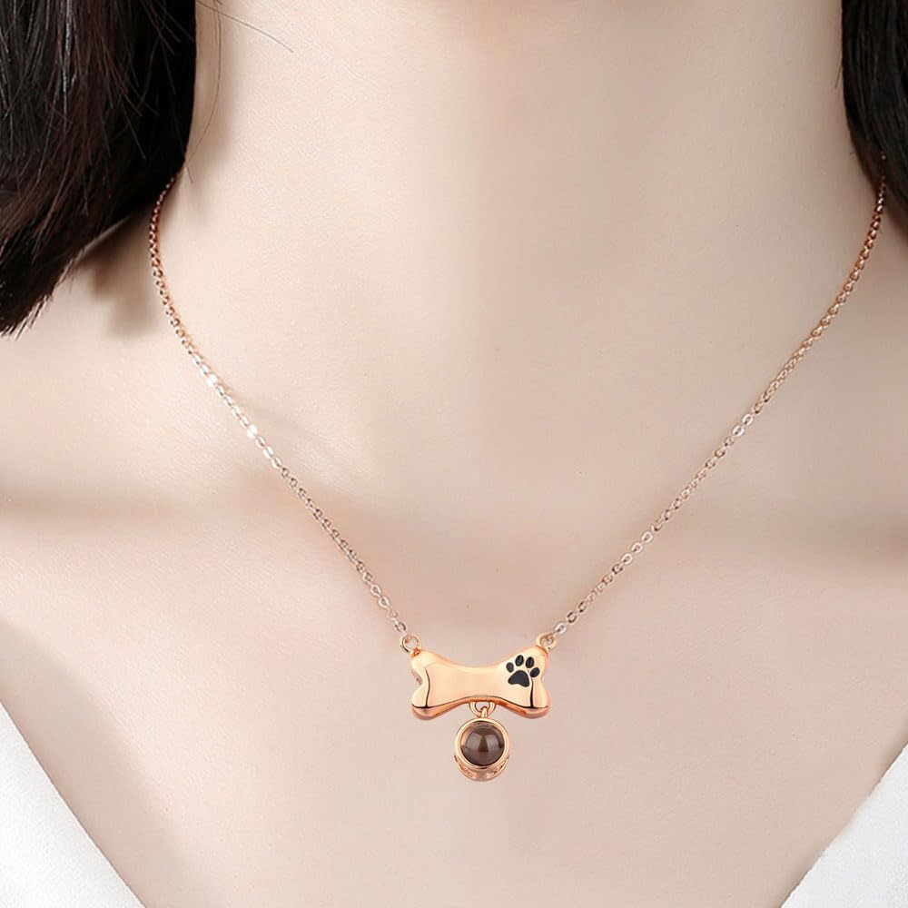 Flashlight projecting a pet photo through the custom projection necklace stone.