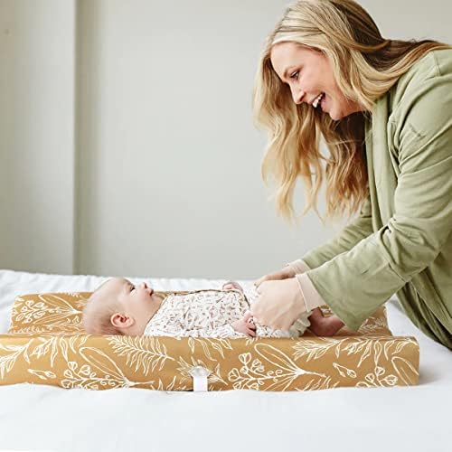 GRSSDER baby changing pad protector fitted snugly onto a standard nursery table cushion.