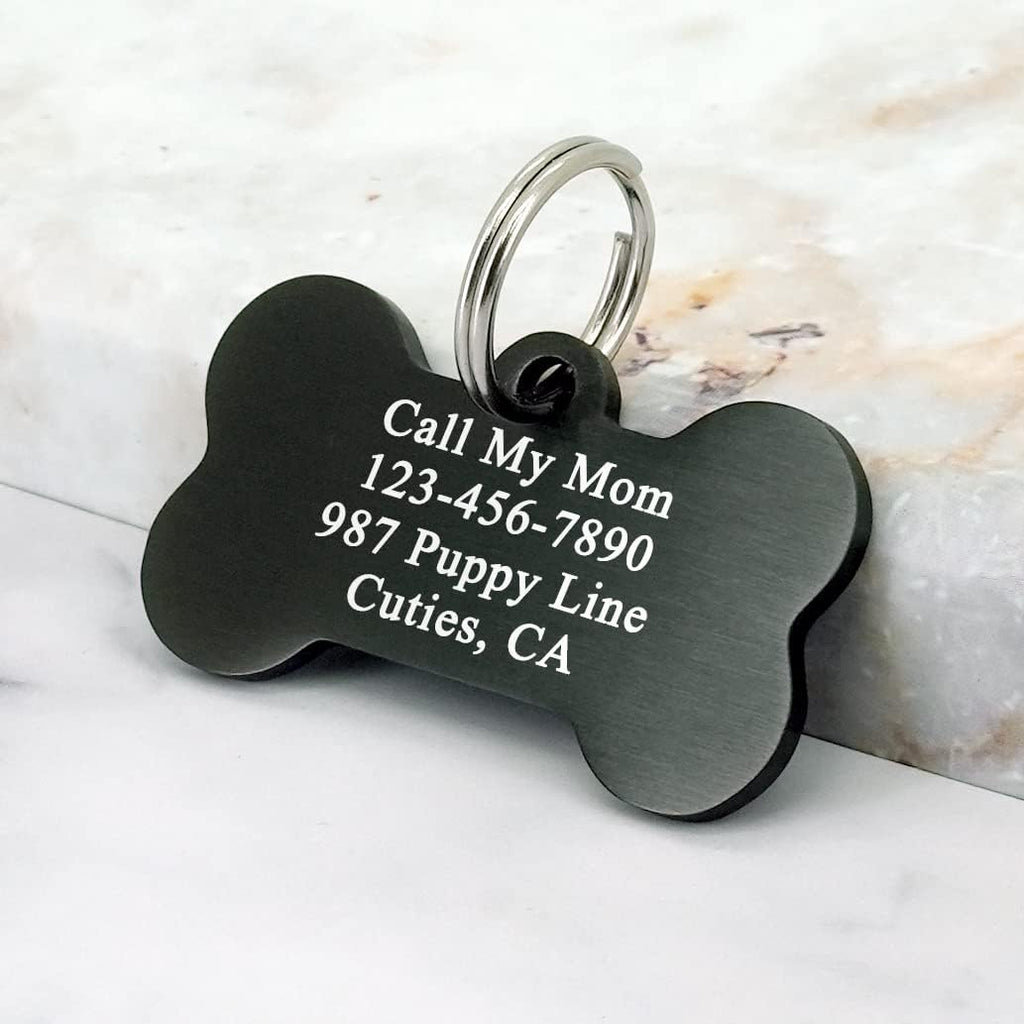Durable dual sided engraved pet name tag attached to a large dog collar.