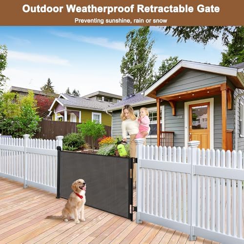 BETERTEK retractable baby gate safety lock close up mechanism being operated with one hand