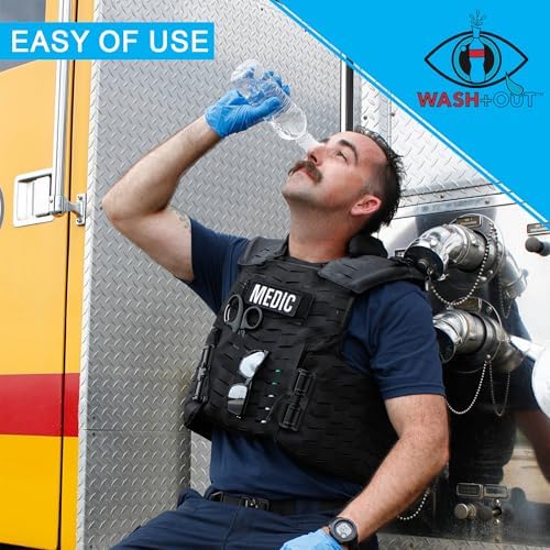 Person using the Wash+Out device to flush dust from eyes during construction work
