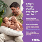Parent using Boppy Uplift nursing pillow with adjustable belt