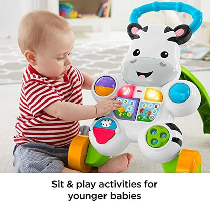 Close up of the light up buttons and flip book on the learning activity toy.