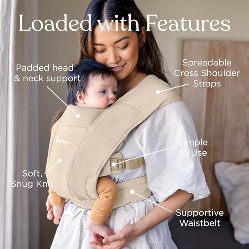 Parent wearing infant in Ergobaby Embrace newborn wrap