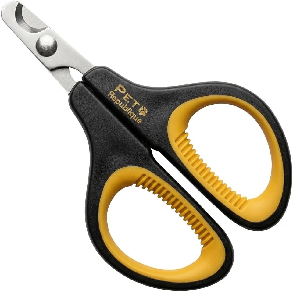 Pet Republique kitten nail clipper being held to demonstrate the symmetrical non slip comfortable grip.
