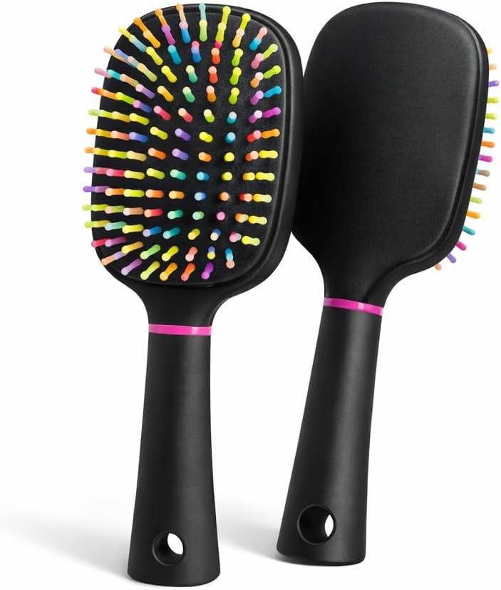 Adkoat rainbow air cushion grooming brush front view showcasing colorful wavy bristles on a black paddle base.