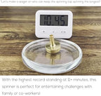DjuiinoStar brass spinning top in motion demonstrating its design