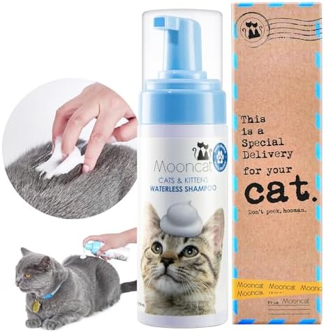 Mooncat waterless cat shampoo bottle next to grooming brush set